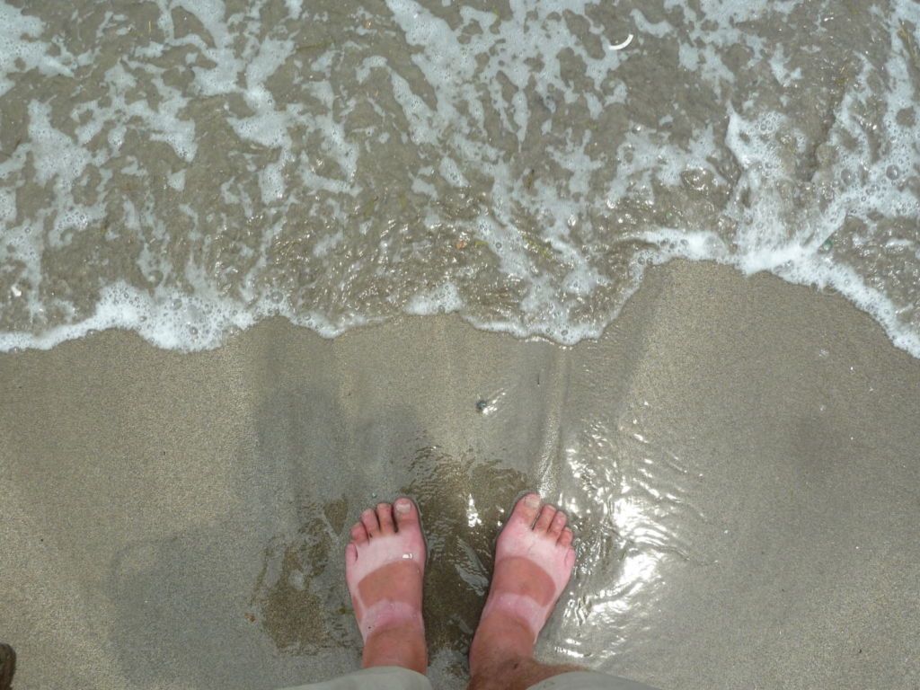 Feet by waves