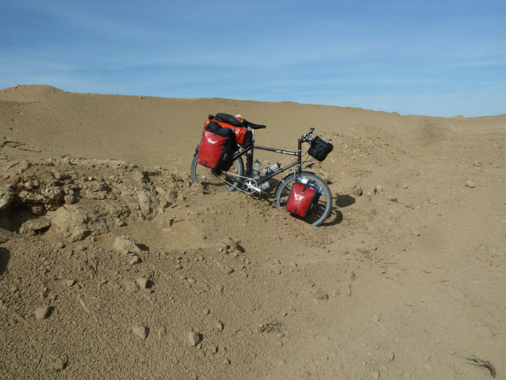 Bike with panniers stuck in sand