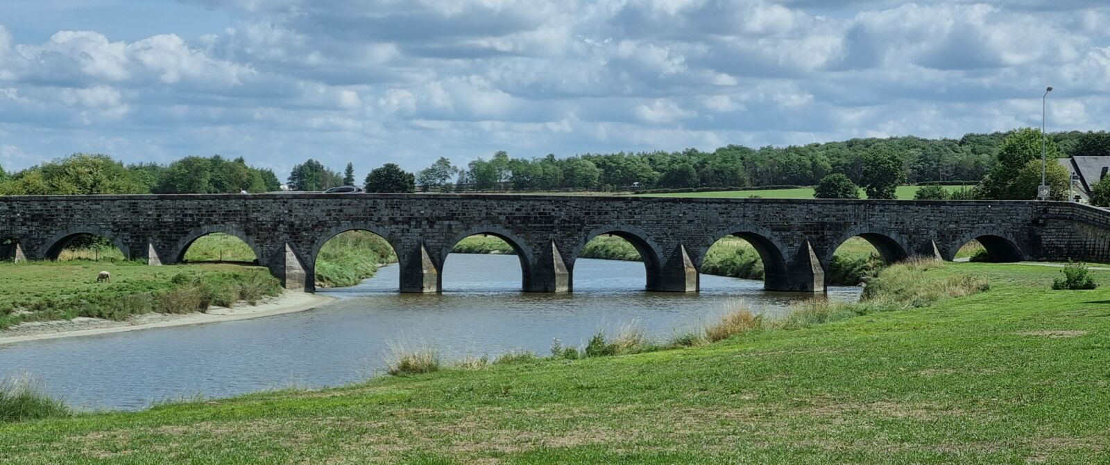 Arched bridge over water
