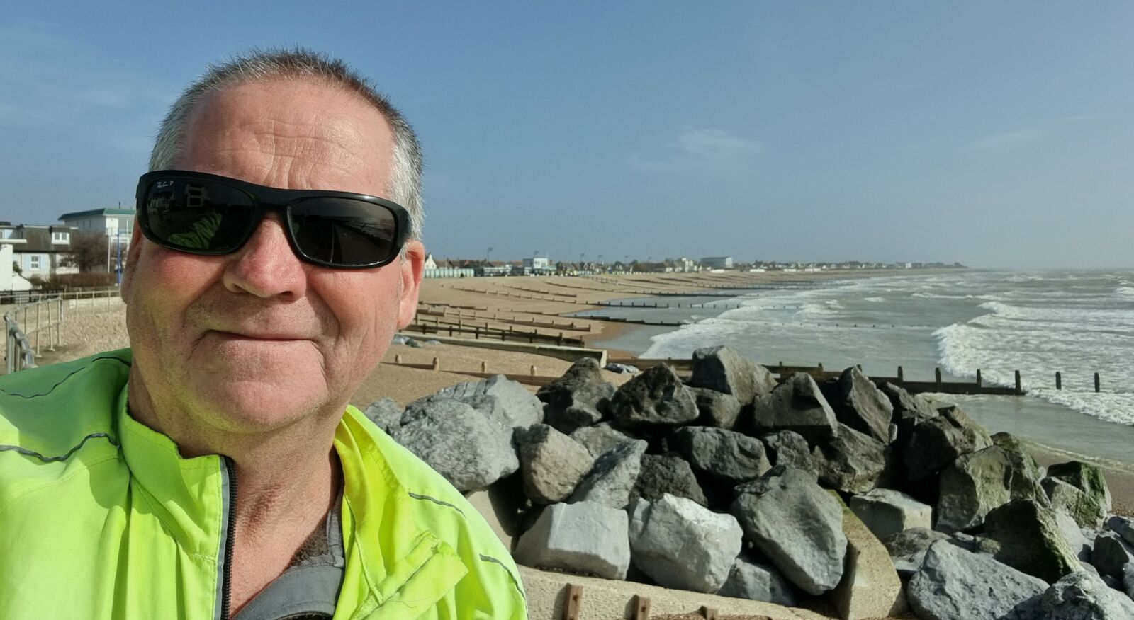 Man in sunglasses by sea