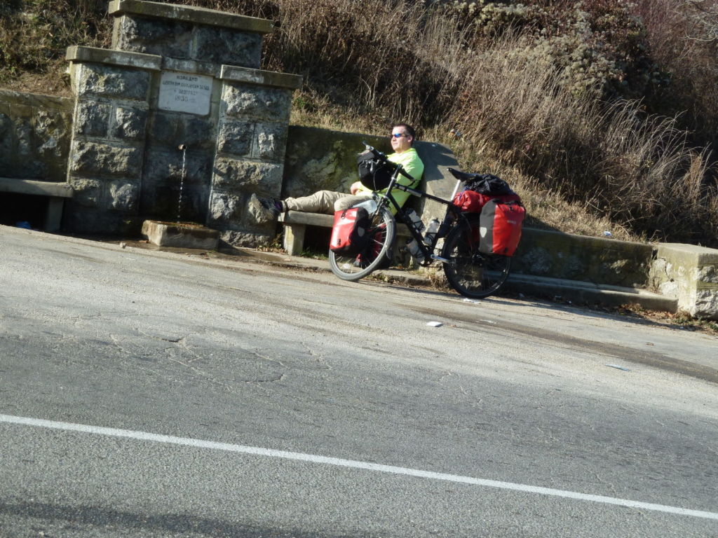 Man sitting by bike