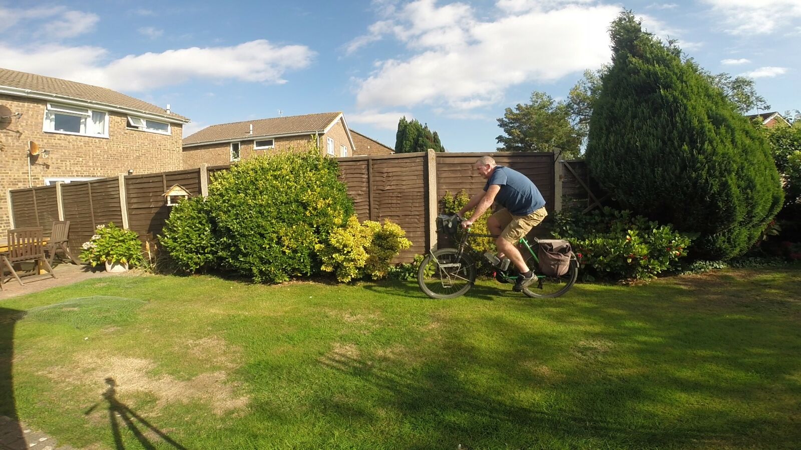 Garry McGivern riding his bike in his garden