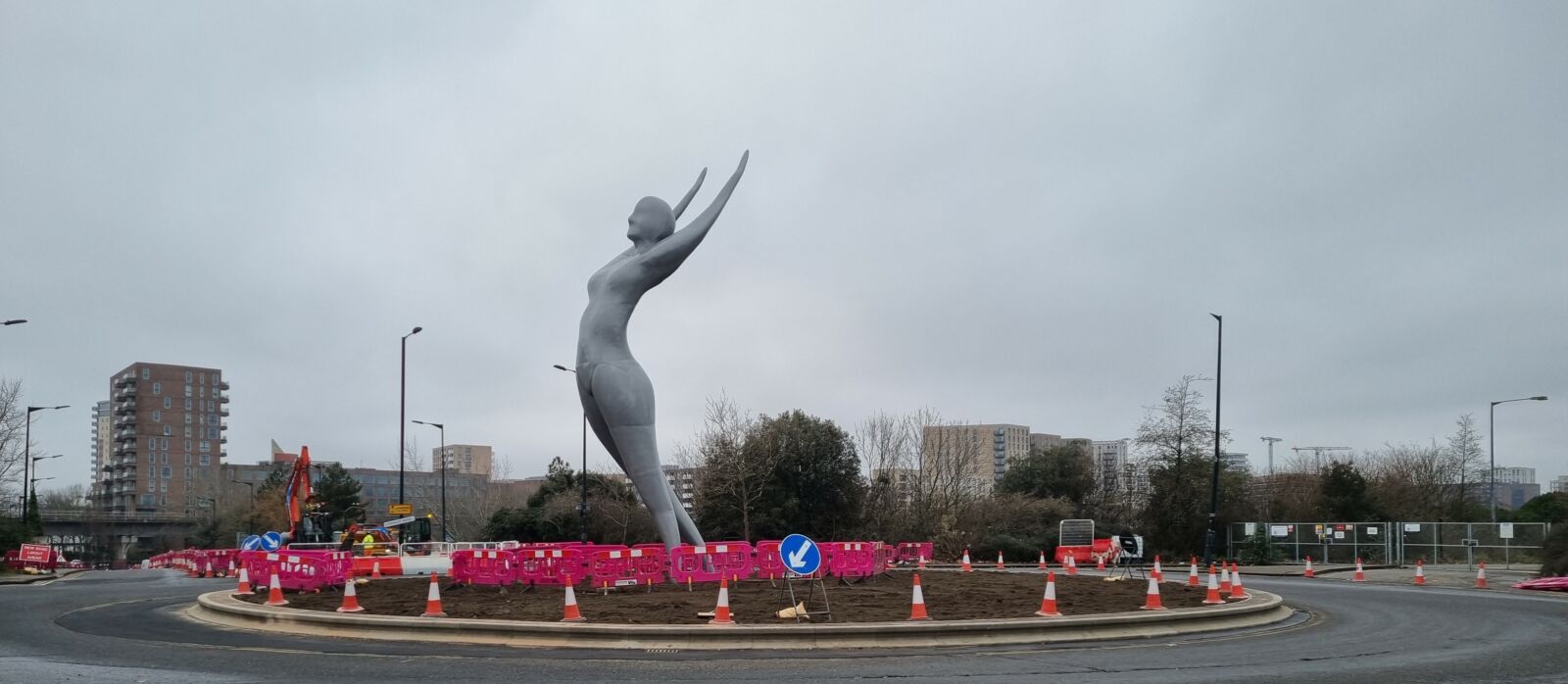 Statue of a lady with her arms in the air