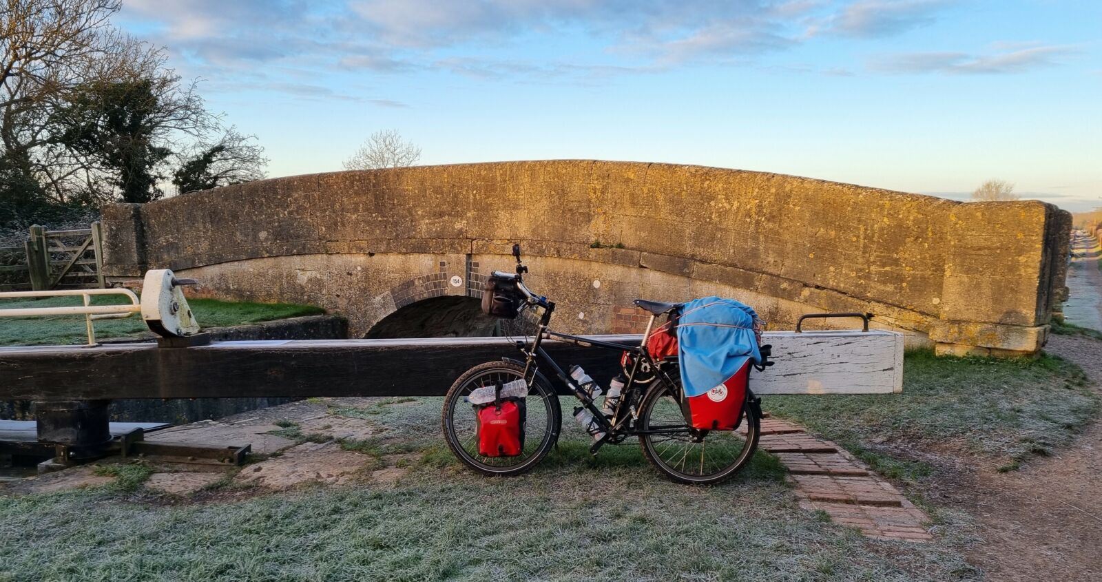 A bicycle parked on a stone wall