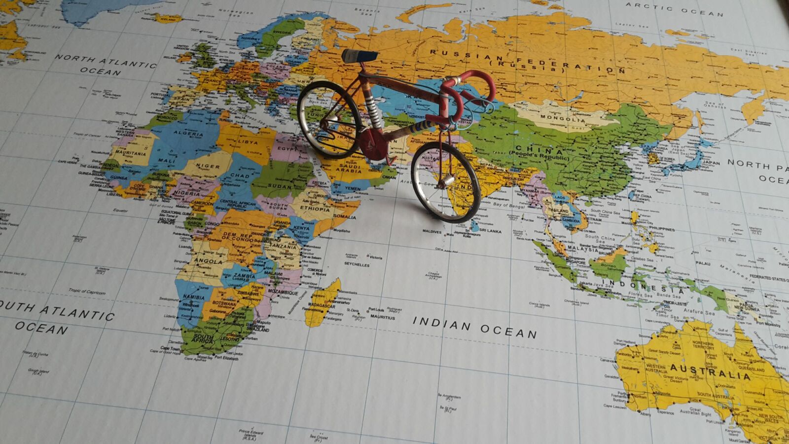 Bicycle on a map of the world