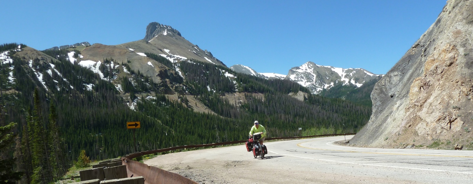 Man cycling on a mountainous road